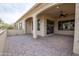 Open patio area with tile flooring, offering ample space for entertaining and relaxing at 16868 W Earll Dr, Goodyear, AZ 85395