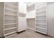 Well-organized walk-in closet with ample shelving and storage at 16868 W Earll Dr, Goodyear, AZ 85395