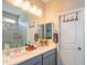 Bright bathroom featuring a double sink vanity, shower, and neutral color palette at 17342 W Patrick Ln, Surprise, AZ 85387