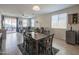 Bright and airy living space featuring a dining area, sliding glass doors, and a comfortable seating area at 17342 W Patrick Ln, Surprise, AZ 85387