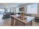 Open-concept layout featuring a dining area, kitchen, and living room, perfect for entertaining and gatherings at 17342 W Patrick Ln, Surprise, AZ 85387