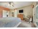 A main bedroom offering a view, television, and large closet at 18037 N 14Th Pl, Phoenix, AZ 85022