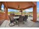 Outdoor dining area featuring a built-in grill and ceiling fan at 18037 N 14Th Pl, Phoenix, AZ 85022