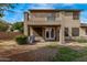 This home's backyard boasts a second story balcony and covered patio at 1917 S Rock Ct, Gilbert, AZ 85295