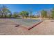 Outdoor basketball court with painted lines, providing space for recreational games and community activities at 1917 S Rock Ct, Gilbert, AZ 85295