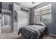 A bedroom is decorated with personal touches, featuring neutral walls, a closet, and a window at 1917 S Rock Ct, Gilbert, AZ 85295