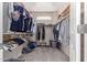 Walk-in closet with multiple hanging rods and shelves for ample storage and organization at 1917 S Rock Ct, Gilbert, AZ 85295