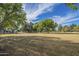 Expansive community park with green space, mature trees, volleyball court and shaded picnic areas offers residents recreational space at 1917 S Rock Ct, Gilbert, AZ 85295