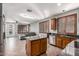 Spacious kitchen with stainless appliances, island, breakfast bar, and access to a cozy living area at 1917 S Rock Ct, Gilbert, AZ 85295