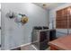 Laundry room with modern stainless steel appliances and a window at 1917 S Rock Ct, Gilbert, AZ 85295