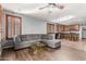 Open-concept living room with sleek hardwood floors, and kitchen area at 1917 S Rock Ct, Gilbert, AZ 85295