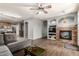 Spacious living room featuring a stone fireplace, modern furnishings, and an open layout at 1917 S Rock Ct, Gilbert, AZ 85295