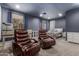 Spacious main bedroom with dual reclining chairs, a desk, and large windows for ample natural light at 1917 S Rock Ct, Gilbert, AZ 85295