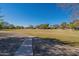 Expansive grassy community park with walkway and mature trees, perfect for outdoor activities at 1917 S Rock Ct, Gilbert, AZ 85295