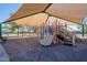 Shaded community playground with slides and play equipment for recreational activities at 1917 S Rock Ct, Gilbert, AZ 85295