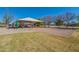 Community playground featuring covered play structures, a slide, and a volleyball net for outdoor enjoyment at 1917 S Rock Ct, Gilbert, AZ 85295
