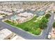 This aerial shot showcases a community clubhouse with pool and tennis courts, all meticulously maintained at 2101 S Meridian Rd # 354, Apache Junction, AZ 85120