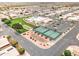 This aerial image highlights the tennis and bocce ball courts within a well-landscaped community at 2101 S Meridian Rd # 354, Apache Junction, AZ 85120