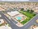 An aerial view shows a community clubhouse with pool, tennis courts, putting green, and well-maintained landscaping at 2101 S Meridian Rd # 354, Apache Junction, AZ 85120