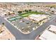 This community offers a clubhouse, pool, tennis courts, and meticulous landscaping, shown in an aerial view at 2101 S Meridian Rd # 354, Apache Junction, AZ 85120