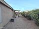 Backyard features low-maintenance desert landscaping, privacy bushes, and shaded patio area at 2101 S Meridian Rd # 354, Apache Junction, AZ 85120