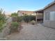 Well-maintained backyard with desert landscaping provides a private outdoor retreat at 2101 S Meridian Rd # 354, Apache Junction, AZ 85120