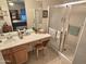 Bathroom featuring a vanity area, glass shower and view into the main bedroom at 2101 S Meridian Rd # 354, Apache Junction, AZ 85120