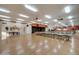 Spacious event space with stage, lighting, fans, and ample seating for large gatherings at 2101 S Meridian Rd # 354, Apache Junction, AZ 85120