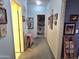 Hallway with carpet, artwork and a doorway to the laundry room and to other rooms at 2101 S Meridian Rd # 354, Apache Junction, AZ 85120