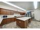 Large kitchen with stainless steel appliances, center island, and custom cabinets at 2101 S Meridian Rd # 354, Apache Junction, AZ 85120