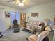 Comfortable living room featuring classic furnishings, a ceiling fan, and ample space for relaxing at 2101 S Meridian Rd # 354, Apache Junction, AZ 85120