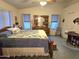 Bright main bedroom features a neutral palette, ceiling fan, and natural light at 2101 S Meridian Rd # 354, Apache Junction, AZ 85120