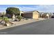 Picture of a quiet neighborhood street shows homes with desert landscaping and attached garages at 2101 S Meridian Rd # 354, Apache Junction, AZ 85120