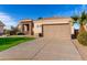 Single-story home featuring desert landscaping, three-car garage, and stone accents at 2109 N Nancy Ln, Casa Grande, AZ 85122