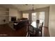 Spacious living room with hardwood floors, fireplace, ceiling fan, and sliding doors to the patio at 2109 N Nancy Ln, Casa Grande, AZ 85122