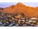 Breathtaking aerial view showcasing the home's location near the majestic mountain range, surrounded by beautiful homes at 2260 E Palmaire Ave, Phoenix, AZ 85020