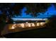 Inviting backyard featuring manicured lawn and privacy wall with garden, all under a colorful, twilight sky at 2260 E Palmaire Ave, Phoenix, AZ 85020