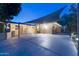 Back patio with an awning for shade, a brick exterior, and ample space for entertaining at 2260 E Palmaire Ave, Phoenix, AZ 85020