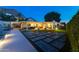 Spacious backyard featuring modern patio area, manicured turf, with a stone pathway, ideal for outdoor activities at 2260 E Palmaire Ave, Phoenix, AZ 85020