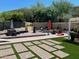 Spacious backyard offering a pool, patio, lounge areas, and lawn, ideal for recreation and relaxation at 2260 E Palmaire Ave, Phoenix, AZ 85020