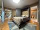 Comfortable bedroom with neutral walls, a murphy bed, and an attached bathroom at 2260 E Palmaire Ave, Phoenix, AZ 85020