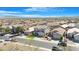 High-angle aerial shot of a neighborhood showing well-maintained homes and landscaping under a bright sky at 22959 W Cocopah St, Buckeye, AZ 85326