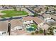 An aerial view of a beautiful house with a pool, patio, and well-manicured lawn and mature landscaping at 22959 W Cocopah St, Buckeye, AZ 85326