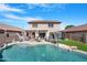 Large backyard features a pool, patio with outdoor seating, and a basketball hoop at 22959 W Cocopah St, Buckeye, AZ 85326