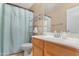 Well-lit bathroom features a single sink vanity and a combined shower and bathtub at 22959 W Cocopah St, Buckeye, AZ 85326