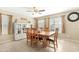 Traditional dining room with tile floors, a ceiling fan, and a table and chairs set at 22959 W Cocopah St, Buckeye, AZ 85326