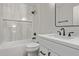 Modern bathroom features marble tile surround, new vanity and black fixtures at 26421 S New Town Dr, Sun Lakes, AZ 85248