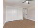 Bedroom featuring ceiling fan, wood floors and closet at 26421 S New Town Dr, Sun Lakes, AZ 85248