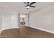 Large bedroom features a ceiling fan and wood floors at 26421 S New Town Dr, Sun Lakes, AZ 85248