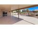 Covered patio with view of the landscaped backyard at 26421 S New Town Dr, Sun Lakes, AZ 85248